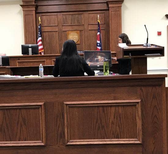 DIRECT. Senior Sarah Horne performs a direct examination of her witness, played by junior Adam Meller, at the regional mock trial competition. The purpose of direct is to allow the witnesses on one’s own side give their side of the case and is extensively prepared and practiced beforehand. Both attorneys and witnesses are scored based on the content and presentation.