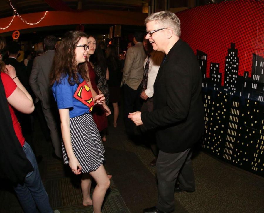 KEEP DANCING. Eleanor Schmid, 12 dances with her dad while Mr. Eddie Clark plays music. “ It was a lot of fun dancing with my dad at Odd couples, and getting to listen to music that is not often heard now days” said Esther Pittinger, 12. Throughout the evening Clark played songs and live music was performed. Students also came and sang in front of their peer throughout the evening.