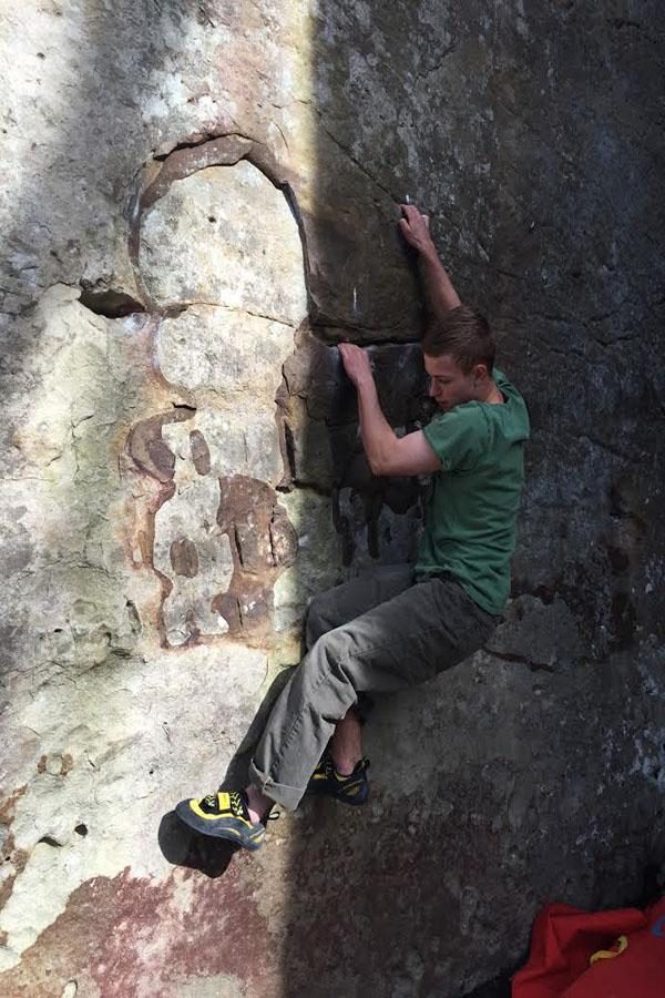 THE BOULDER THE BETTER. Shanks clings to the rock when bouldering in Rock Town, Georgia. Bouldering problems, or routes, are ranked by the V scale, which assesses the 
difficulty of the climb. “The most difficult routes in the world are V17; I’ve probably climbed a V6 at most,” Shanks said.