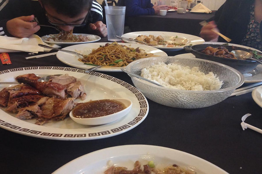 YIP+YIP+HOORAY.+My+brother+greatly+enjoys+his+food.+The+duck+and+the+rice+sit+in+the+front%2C+while+the+Lo+Mein%2C+beef%2C+and+the+tofu+are+in+the+background.+Diners+have+the+choice+of+eating+with+chopsticks+or+with+other+utensils.