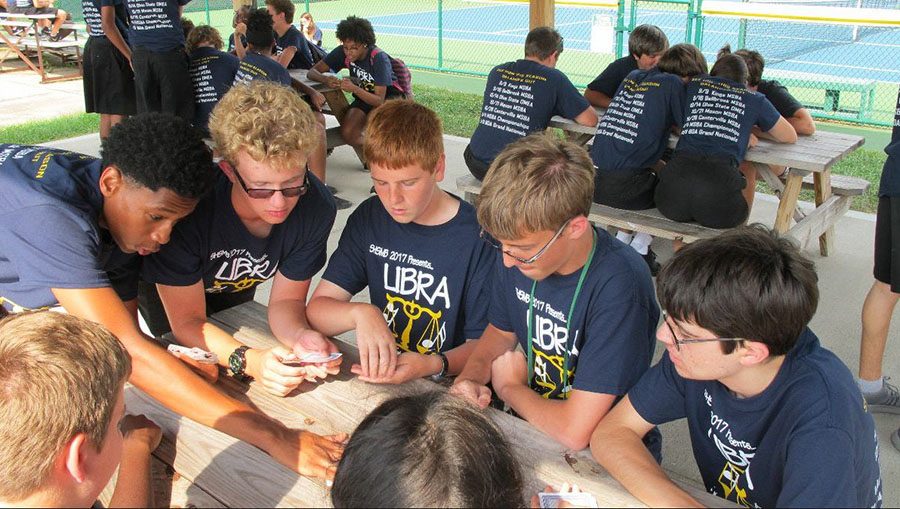 TOGETHER. Before performing their show Libra, the marching band enjoys a picnic. The band has yet to have their first competition but will Sat Sept. 9. The competition will be held at Kings High School and Libra will be shown around 9:00 pm. 