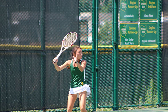 FOCUS. Senior Kaitlyn Jiang shows her intensity on the court during a match. Jiang competes at a high level. She also holds the captain’s position on the Varsity Gold team.