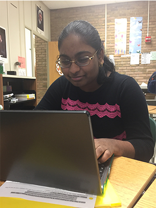 GIRL WHO CODES. Sophomore Anupama Narayana, a GWC co-founder, works on her laptop. Narayana has been block coding since third grade. “I did not learn how to do text coding until ninth grade,” Narayana said.