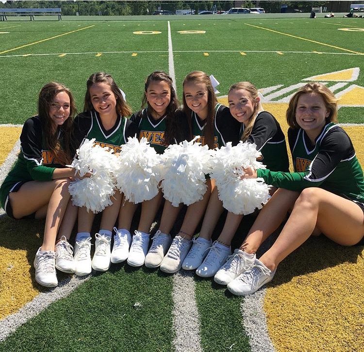 GO AVES. Long (far left) and her squad have to juggle not only pompoms but also school and their friends. “Though cheer takes up a good portion of my time and will take even more with the upcoming competition, it’s not too hard to handle for me. It does take away my time on weeknights to do my homework or spend time with my family, but that’s made up on the weekends because, excluding Friday nights, we don’t have cheer on the weekends,” Long said. The squad has grown close through years of cheer and will continue to light up the stands of SHS’ games and pep rallies.