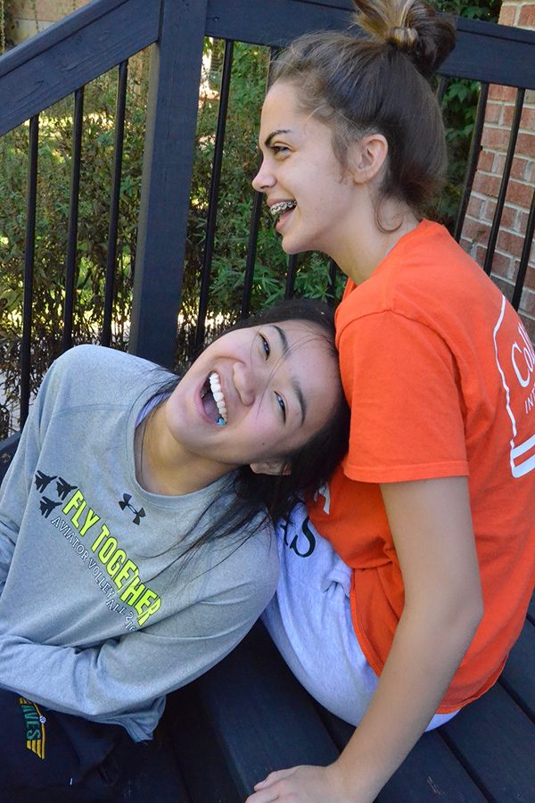 LAUGH OUT LOUD. JV defensive specialist Meredith Ringer and Varsity defensive specialist Anna Helker often hang out outside of volleyball practice. Helker is Ringer’s big sister again. Though the girls are two grade levels apart, they are now best friends. “As an underclassmen, I love having a ‘big sis’ to look up to. If you have a question, they’re there, not only on the court but throughout the school day,” Ringer said. Photo by Meredith Ringer.