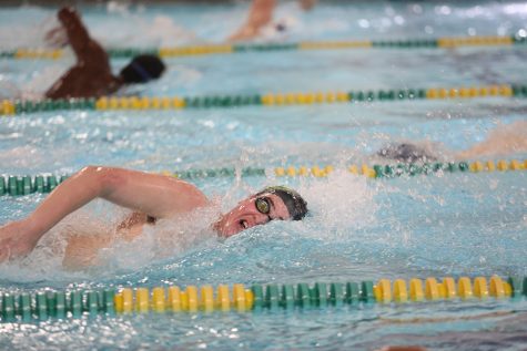 Swimmers dive into tryouts