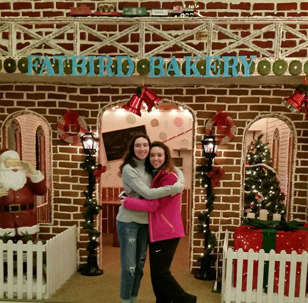 HOLIDAY SPIRIT OVERLOAD. Two Sycamore students are in front of a structure made of gingerbread and icing on Christmas Eve. The life-sized gingerbread house is in Nemacolin, Pennsylvania. They participate in holiday festivities at a more proper time.