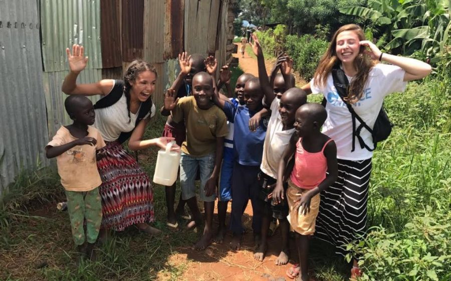 Senior+Makayla+Stover+smiles+for+a+picture+with+Ugandan+children.+Stover+had+the+opportunity+to+go+on+a+trip+to+Uganda.+These+children+are+part+of+the+community+of+several+Uganda+children+Unified+for+Uganda+helps.