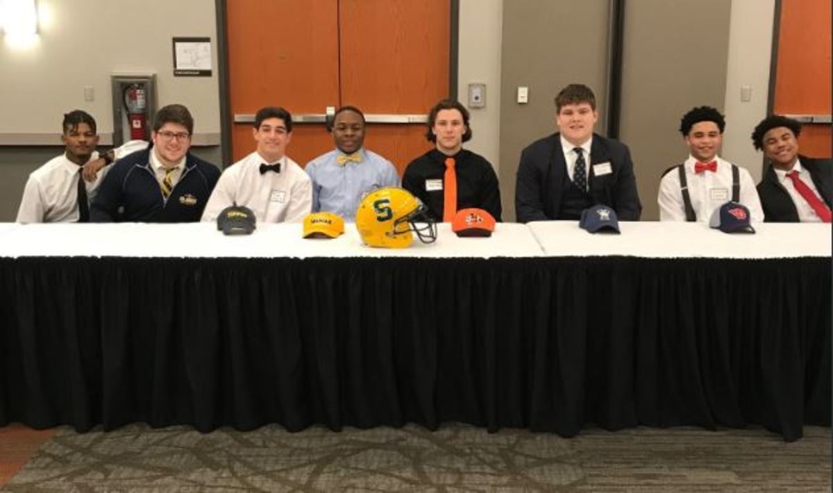 ONWARDS.+Seniors+in+football+celebrate+their+signings+on+Feb.+7.+Feb.+7+was+this+year%27s+National+Signing+Day%2C+and+social+media+was+full+of+schools+and+teams+celebrating+what+is+coming+next+year.+SHS%27+celebration+of+the+event+was+postponed+due+to+weather.+Photo+courtesy+of++Scott+Datillo.+