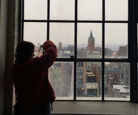 SNAP. Sophomore Chloe Mensch strives for the best angle at the Art Academy on Feb. 1. A goal of the New Voices program is to visit diverse locations that will spark creativity. Some examples of these are the Plum Street Temple, Memorial Hall, and even a ride on the streetcar.