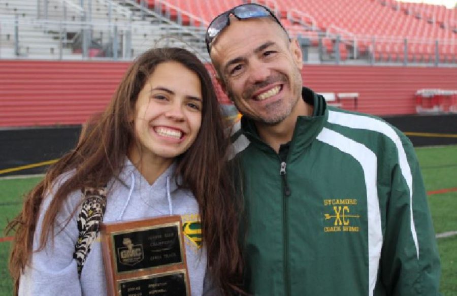 PRACTICE MAKES PERFECT. Gabriela Pereda snaps a photo with Mr. Richard Shomo.  This photo was taken last year after a track team victory. The girls track team won GMC’s for the first time in 17 years. 