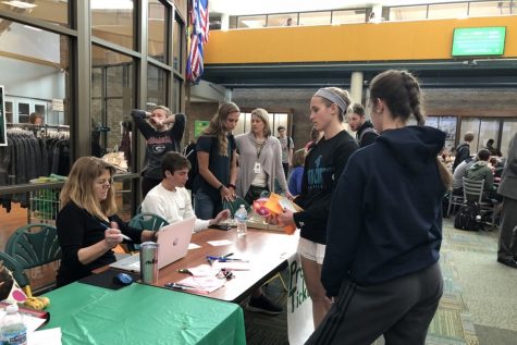 TICKETS. Student Council and PTO members sit at the tables in the Commons, selling tickets for Prom and After Prom during lunch. Prom tickets cost $35 while After Prom tickets cost $20. Money from sales will help fund the events.