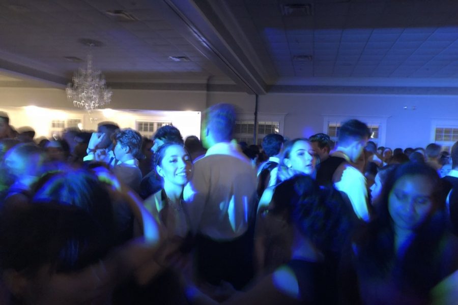 DANCING ALL NIGHT. Senior Melinda Looney dances with other juniors and seniors at the prom on April 28. Prom took place from 8:00 p.m. to 11:30 p.m. at the Manor House in Mason. There were drinks and small snacks provided to add to the event