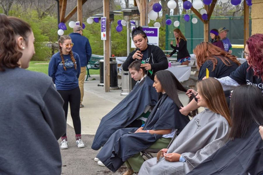 I GOT BANGS. Any person could also donate their hair during the event. RFL brought in volunteers from Great Clips to do the cutting. While most girls simply cut off a good length of hair, sophomore
Lydia Masset shaved her head. 