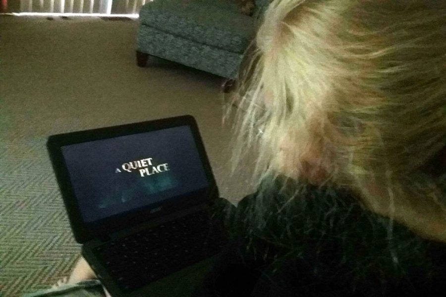 NEW KIND OF HORROR. Freshman, Annamarie Jowanovitz,  watches the horror film A Quiet Place. The film uniquely brings together tense action and gripping family drama, which creates something more intense than the average horror film. Its really suspenseful but also really emotional, Jowanovitz said.  