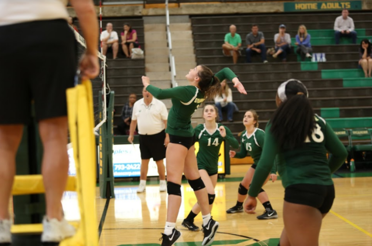 Girls volleyball bonds on court