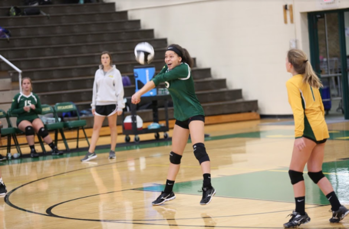 Girls volleyball bonds on court