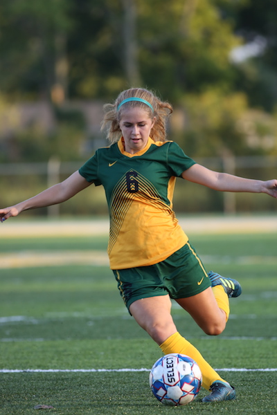 Girls Varsity Soccer plays, bonds