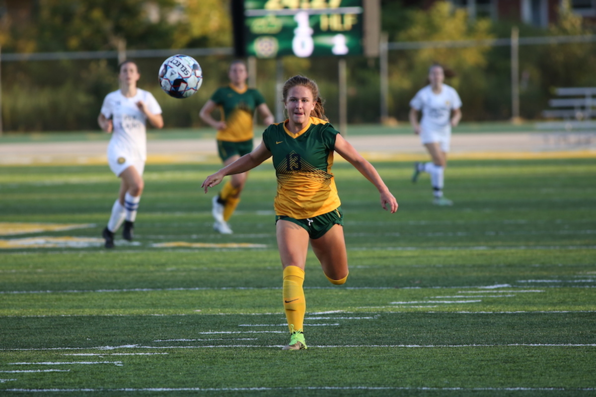 Girls Varsity Soccer plays, bonds