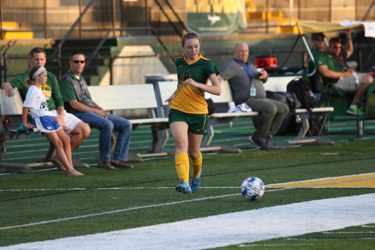 Girls Varsity Soccer plays, bonds