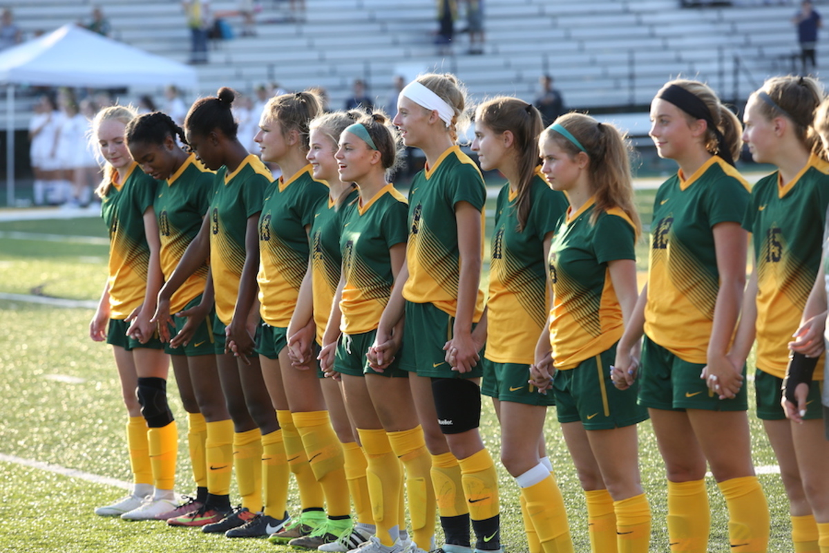 Girls Varsity Soccer plays, bonds