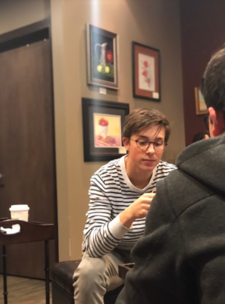 COFFEE AND CONVERSATION. Junior Grant Kilgard enjoys coffee while practicing his conversational French. “I think students really like the comradery of learning and speaking French together,” said Grant Bruner, 12. 