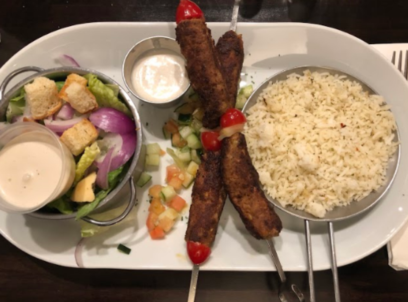 HEALTHY AND DELICIOUS. The kabobs are served on a platter with rice, Israeli salad and tzatziki sauce. “This was by far the best Mediterranean food I have ever had. The food... hit all the right spots,” said Ally Zimmerman, 11.