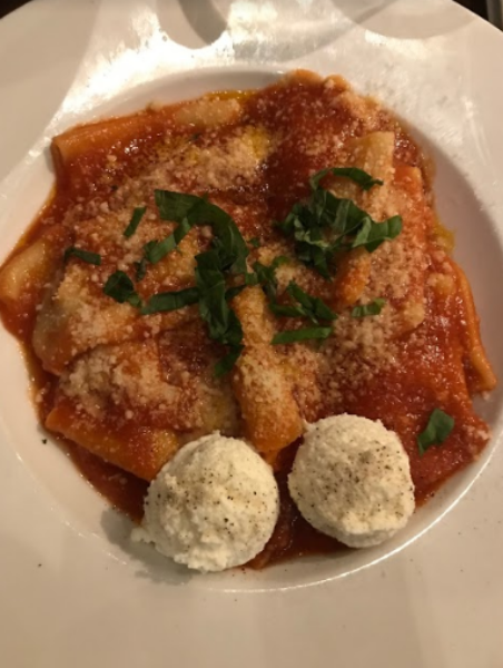 DELICIOUS. The Paccheri is shown with an outstanding red sauce and topped with a coupe basil leaves with ricotta on the side. “The Paccheri is devouring, it is full of flavor,” said Cy Khodadad, 9.