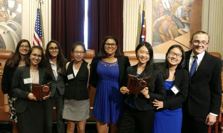 BANG THE GAVEL. Pictured are the two teams from last year, both of which moved on to the quarterfinals. “I am excited about our opportunity to give an oral argument to a judge, especially about a topic as interesting as the second amendment,” said Teddy Weng, 12, Moot Court member.