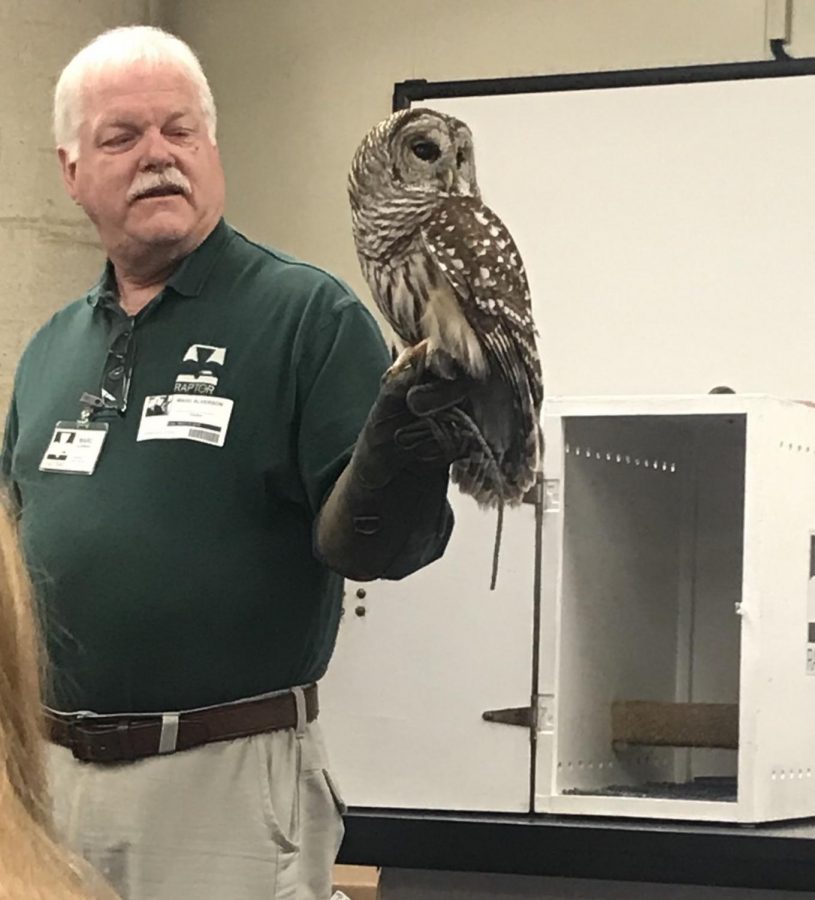 Field Biology students had a few special guests before they departed for Spring Break. On Fri., March 15, Raptor came with three different types of owls to show the students. Pictured here is a Barred owl with the guest speaker. All the animals are injured in some way or cannot be successfully reintroduced into the wild. In the class, students will have to identify the different owl hoots per species, so the class today was a great chance to study up on the calls. Mr. Ron Hochstrasser teaches the elective. “With a visit, students get to see the birds they are learning to ID up close,” Hochstrasser said.
