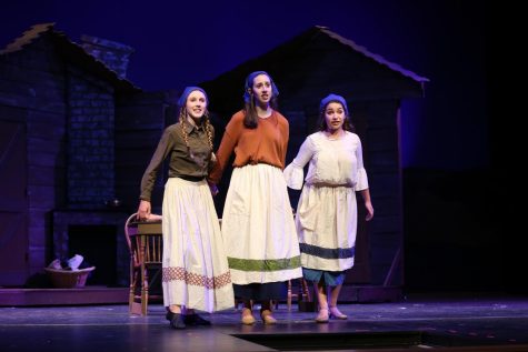 MAKE ME A MATCH. Chava (freshman Peyton Hines), along with her sisters Tzeitel and Hodel (seniors Sydney Weiss and Shayna Kling) sing about what the future will bring for her in a scene from Aves Theatre’s recent production of the hit musical, “Fiddler on the Roof.” The show took place April 11-13 at Sycamore High School, and was a huge success both with the audience and financially. “With this show, we were able to break the record for the amount of tickets sold for a one week show,” said Aves Theatre director Mr. John Whapham