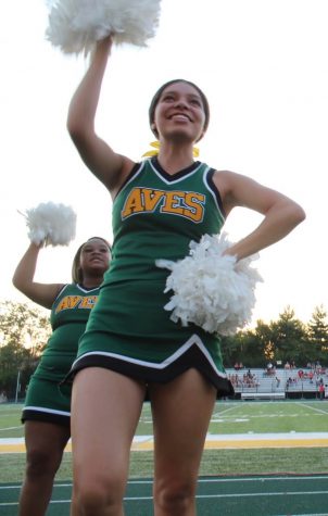 GO AVES GO. Senior cheerleader Kennedy Archer is cheering on the Aves during one of their last home games. “Stepping out on the track to cheer one last time was a decision I was happy I made. I stopped cheering when I got to high school, so I’ve missed the excitement of cheering. This has been an awesome season cheering with my teammates, one I will not forget,” Archer said.