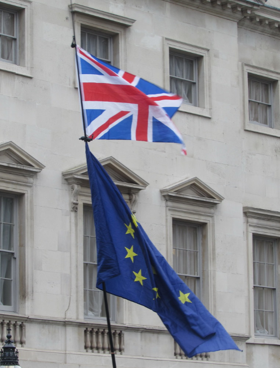 The British flag waves beside the flag of the European Union in the United Kingdom. 
