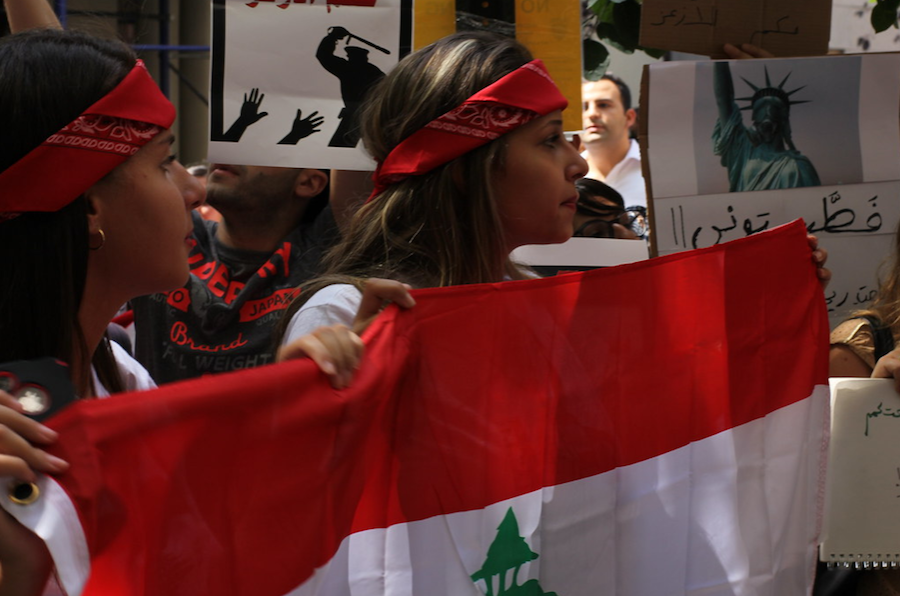 PROTEST. Lebanese demonstrators carry flags and signs while marching through the streets, demanding an end to their injustice. Thousands of people have shown up to march in the streets for weeks now, whether in Lebanon or around the world, to protest their treatment by the government. “This may be the biggest achievement for my generation, winning in a clash of this level with our politicians, said one protestor,  said Balil.  a young Lebanese engineer.
