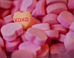 XOXO. This image displays one of the most popular candies on Valentine’s Day: candy hearts. We give these to people with sweet notes written on each heart that they will read while taking out each candy.