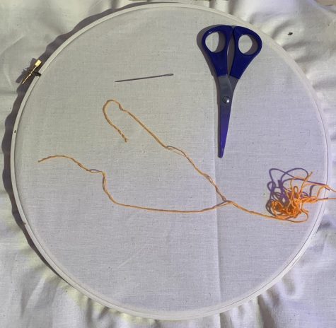 Preparing your materials: To do embroidery you will need fabric, an embroidery hoop, embroidery floss, embroidery needles, and a pair of scissors. I prefer to use muslin fabric, but any tightly woven fabric works. Do not use a stretchy fabric to start learning on, it is very difficult to embroider on especially if you are a beginner. To prepare your fabric, lay it over the inner ring of your embroidery hoop, then place the outer ring around both the fabric and the inner ring and tighten until your fabric is taught. To prepare your embroidery floss you need to split it. If you look closely at the floss, you will notice that it is made up of six individual threads. For all of these stitches I use three strands.