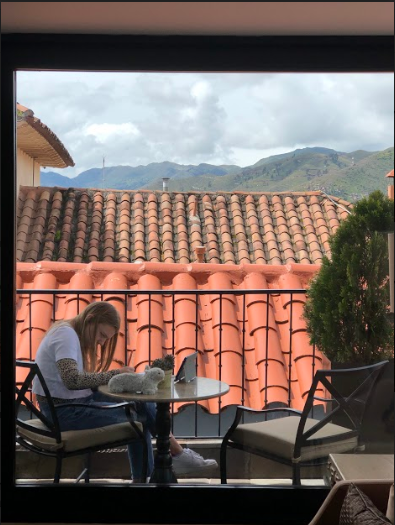 STRANDED IN PERU. Sophomore Chloe Gordon works on her schoolwork while quarantined at a hotel in Cusco, Peru. The Gordon family became stranded in Peru along with thousands of other Americans after the president closed the borders on March 15.  “Until this trip, I took everyday freedoms such as going on runs, driving in a car, and my house for granted. For maybe the first six or seven days I was really relaxed and needed a break. Then I was starting to get stressed out because of online school and I just had my iPad to do school on. So it was really hard to do the work in a timely manner,” said Chloe Gordon, 10. 
