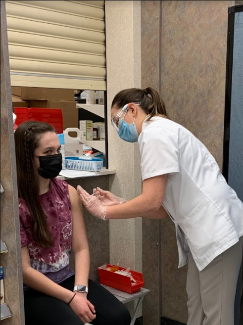 Pictured above is sophomore Claire Dillon who received her first dose of the Pfizer-BioNTech COVID-19 vaccine on March 29. “I think its the tiniest thing...like youre just getting a needle poked in your arm for a quick second and it really does help with the coronavirus efforts so, like I said, if you can get it, absolutely do it… It keeps you safe, it keeps those around you safe,” Dillon said.