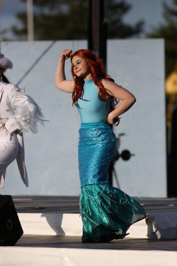 KISS THE GIRL. Morgan Evans performs as Ariel in Sycamore High School’s The Little Mermaid Jr. With a blue outfit decked out with a mermaid’s tail, Evans both looks and acts as wonderful as the cinematic version. 
