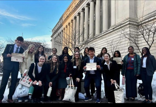 Mock Trial members from Gold and Green team last year pose for a picture in front of the OCLRE building in Columbus. "We all put in so much work [last] year. I know [this] year we’ll come back improved and ready to win!” said Ogunbodede.