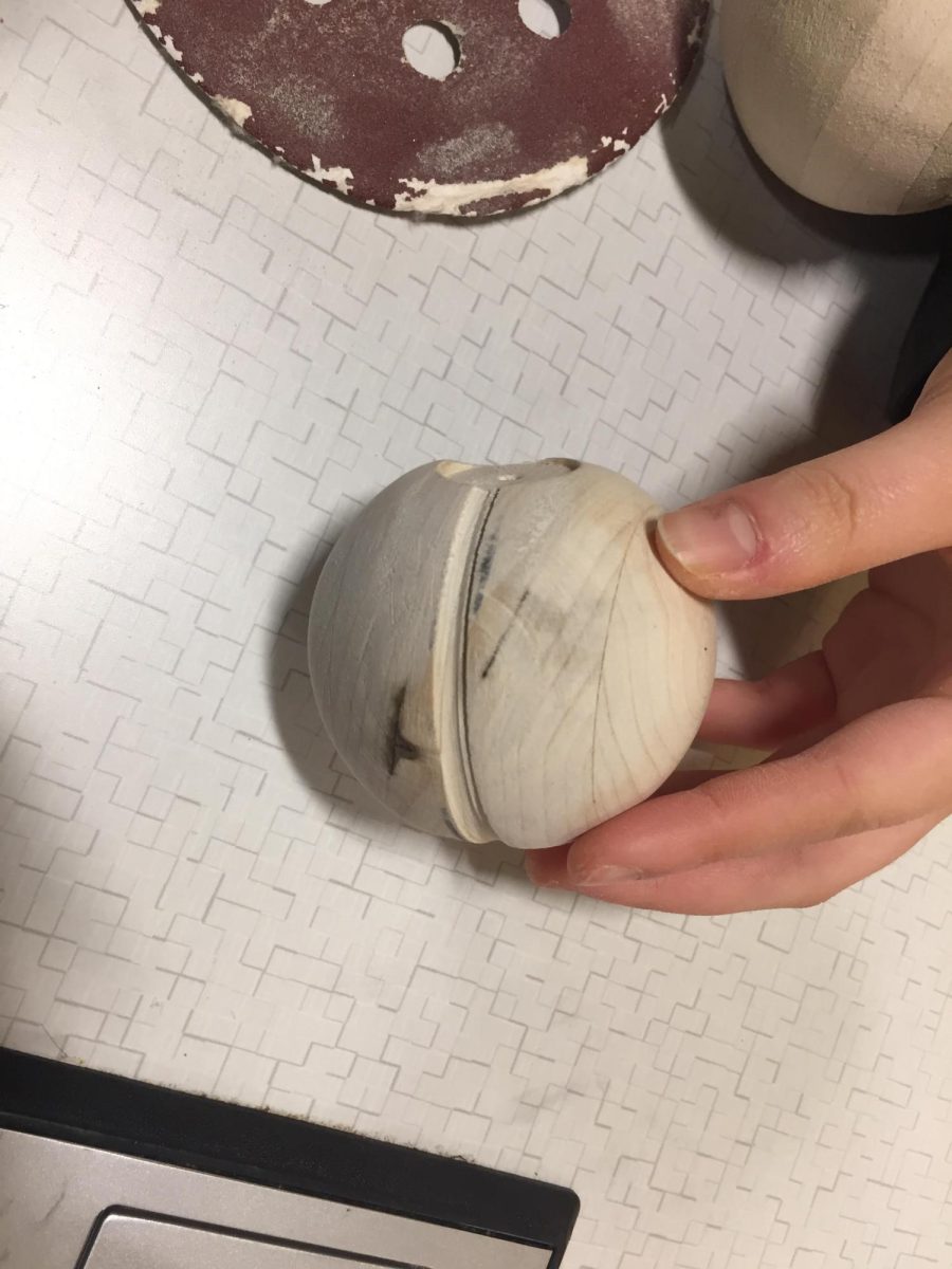 PRACTICE MAKES PERFECT. Brianna Luo, 11, prepares for her woodworking exam by making a wooden ball. She is only one of numerous SHS students cramming in preparations and studying after a flurry of assignments, tests, and quizzes this week. Exam week begins on Monday, December 15 and ends on Thursday, December 18.