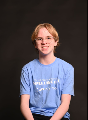 Andrew Jones, 9, poses in a shirt from his last musical, the "25th Annual Putnam Spelling Bee."