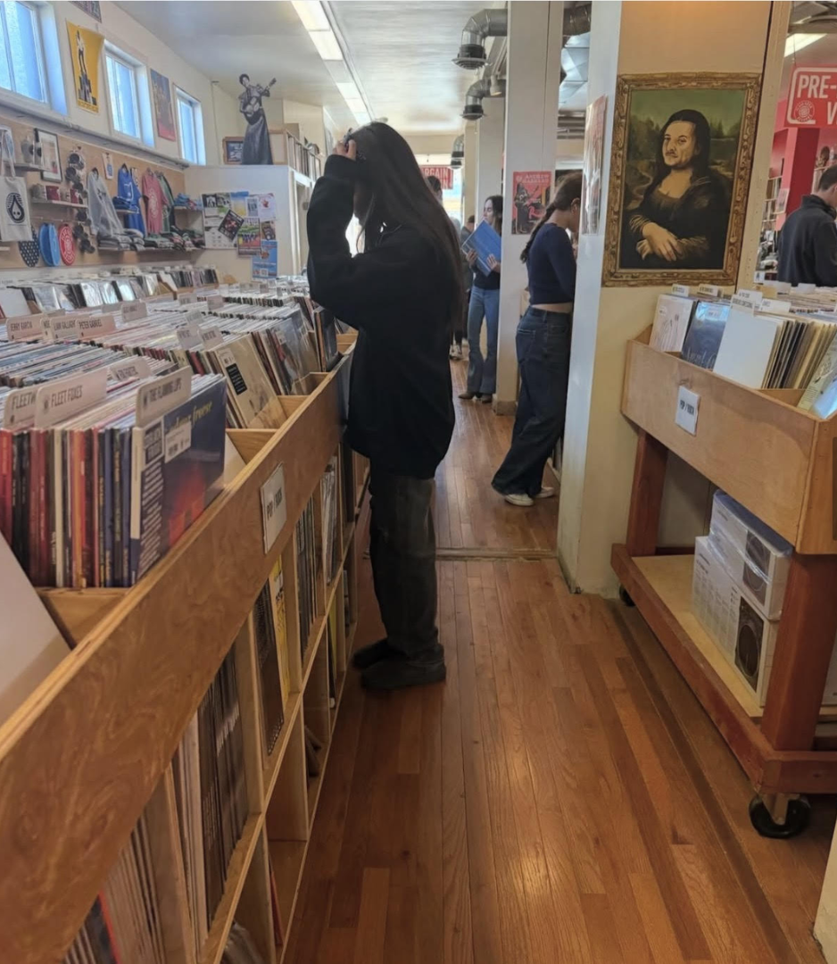 Rayna Sanghani, 11, browses vinyl records at Plaid Room Records in Loveland, OH. “I collect vinyl because it makes me feel more connected to the music ... it is more permanent than just playing something on my phone,” Sanghani said.