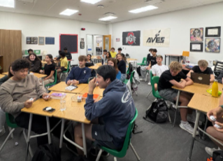 SHS students engage in conversation during a Speech and Debate meeting.