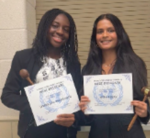 Ifedolapo Ogunbodede, 12, and Myra Sahay, 10, pose for a photo after both winning "Best Delegate" at their Model UN conference.