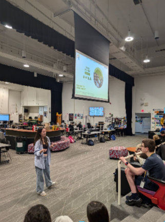 Monica Simon Thomas, 12, presents a Tuesday Talk to Synnovation Lab students.
