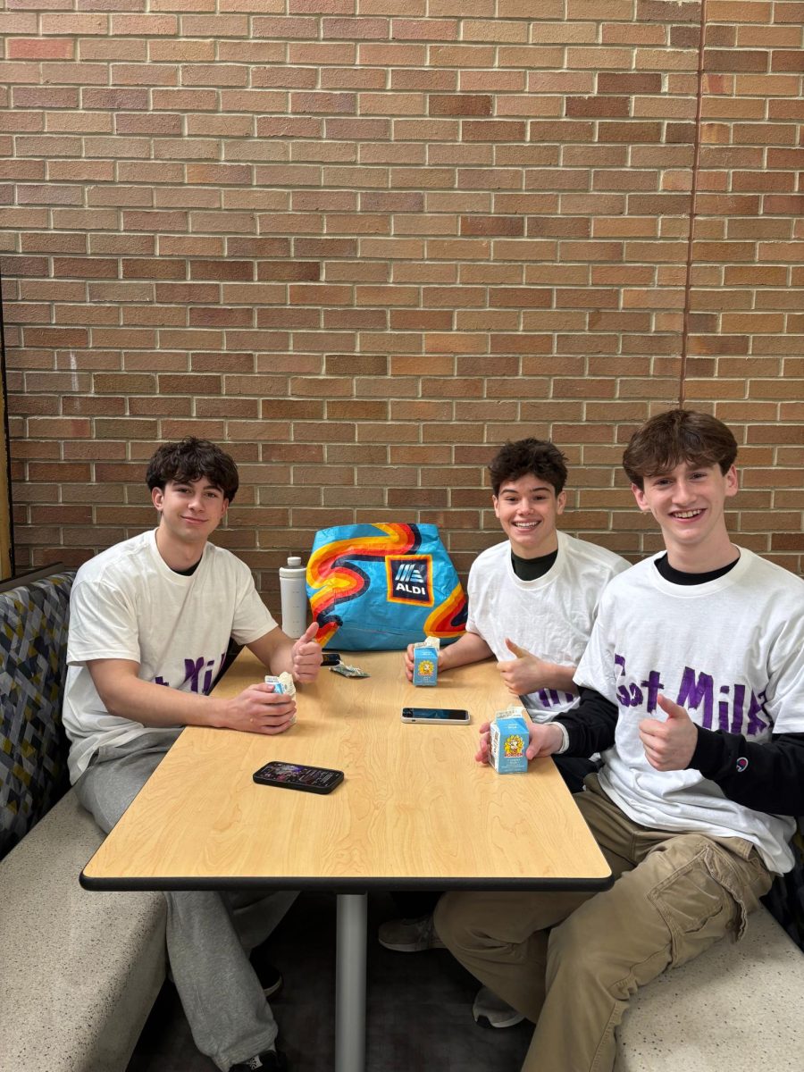 Ari Werthaiser, 12, Luke Carter, 12, and Eli Korach, 12, moments before beginning the milk challenge during B lunch. 